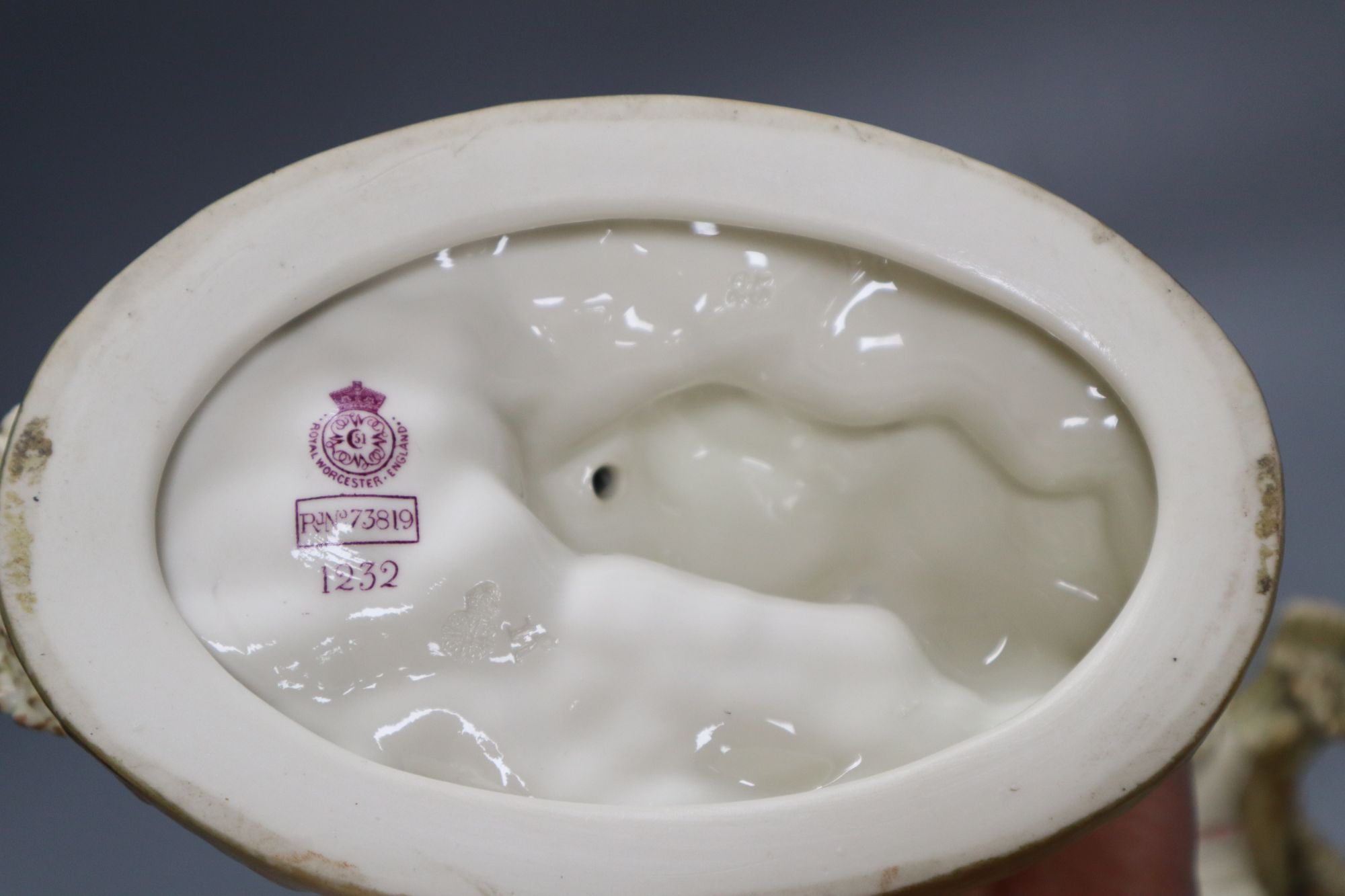 A pair of Worcester James Hadley blush ivory figural dishes, height 15cm